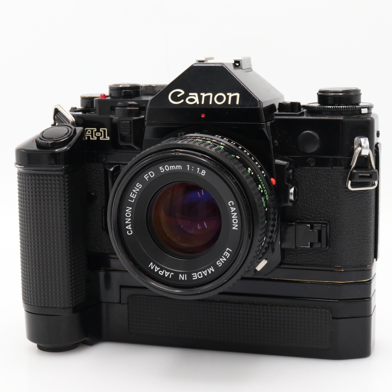 Canon A-1 Boîtier + motoriseur + FD 50 mm F/1.8 occasion